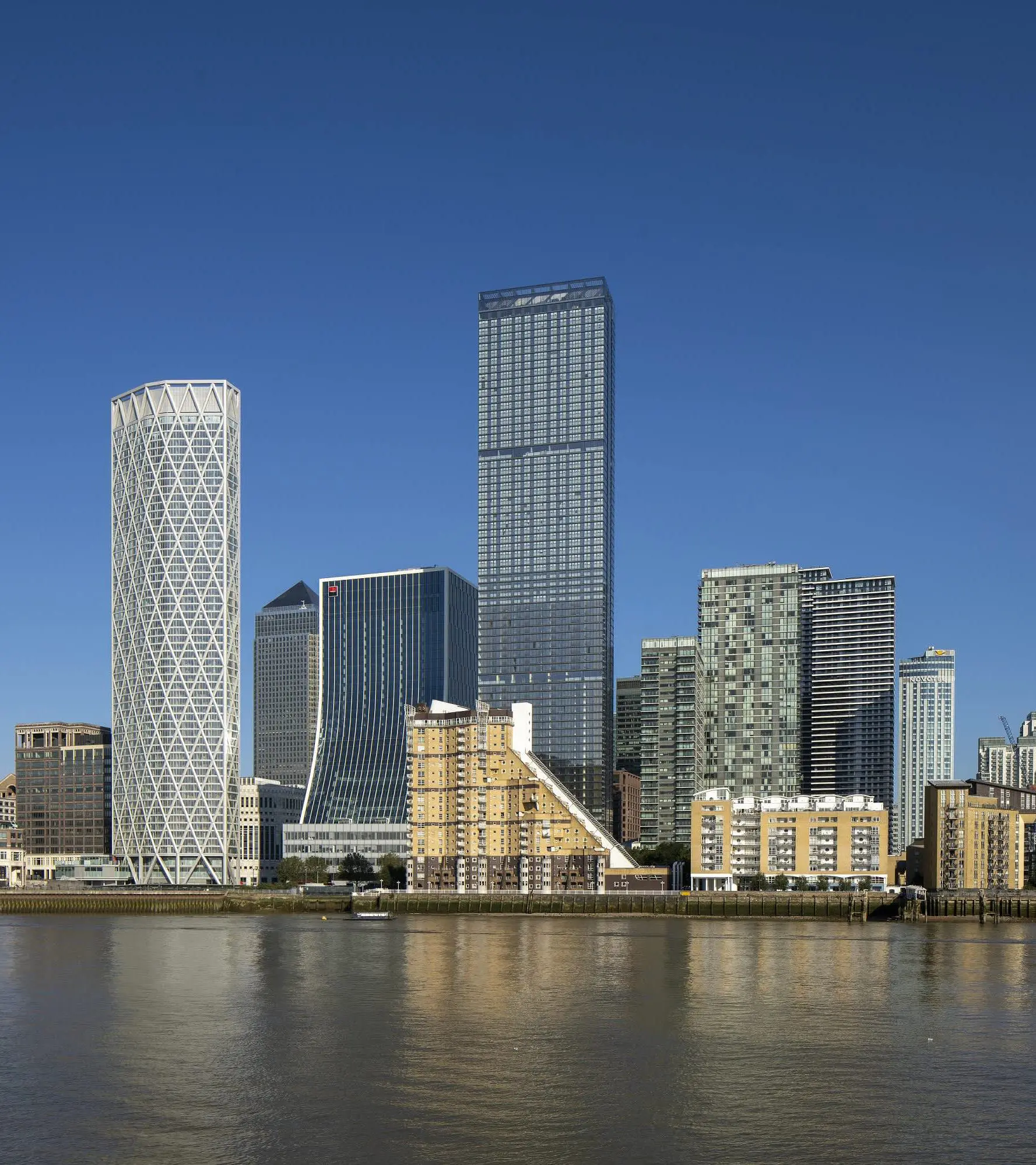 Modern skyline with skyscrapers and river view.