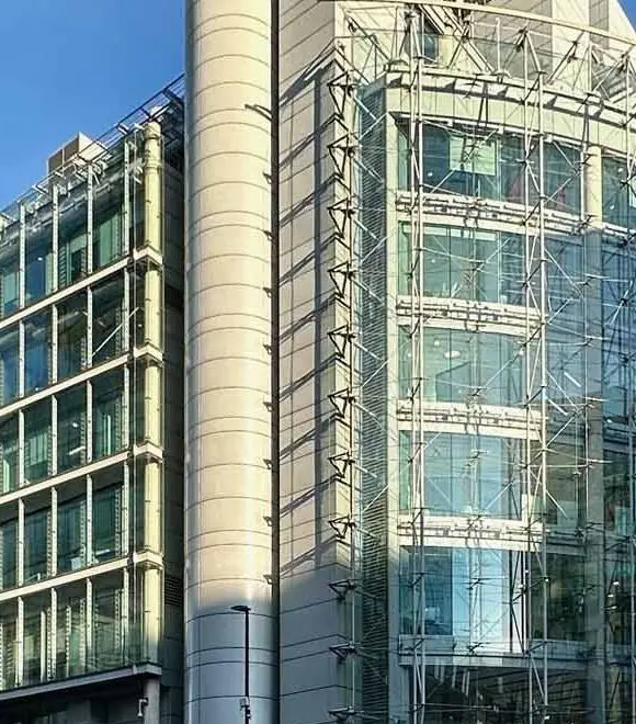 Modern glass and steel office building exterior.