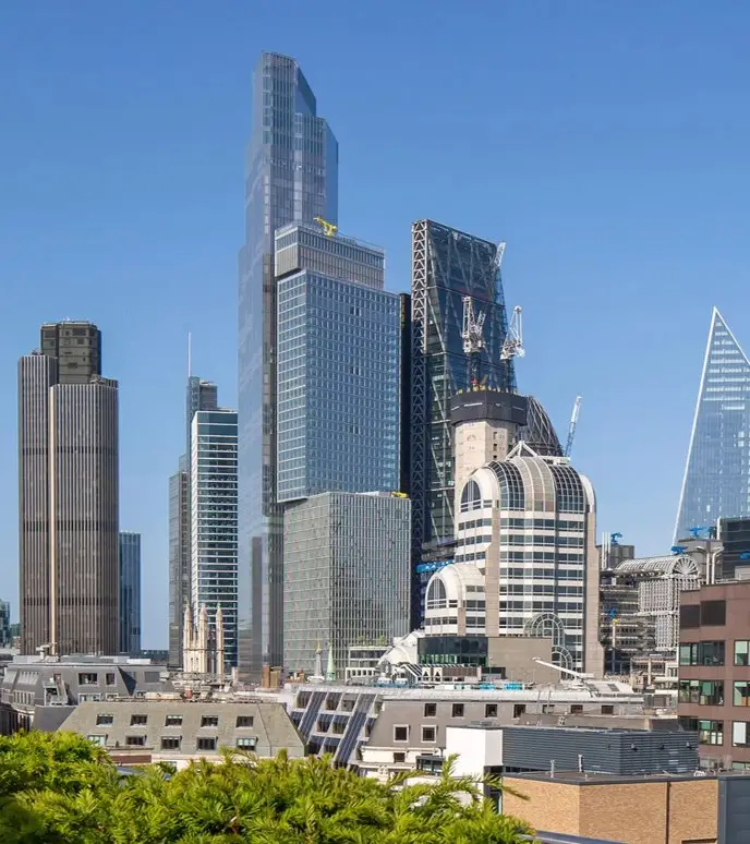 A city skyline featuring modern skyscrapers under a clear sky.